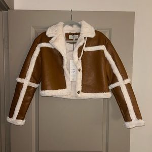 Cropped faux brown leather jacket with fur